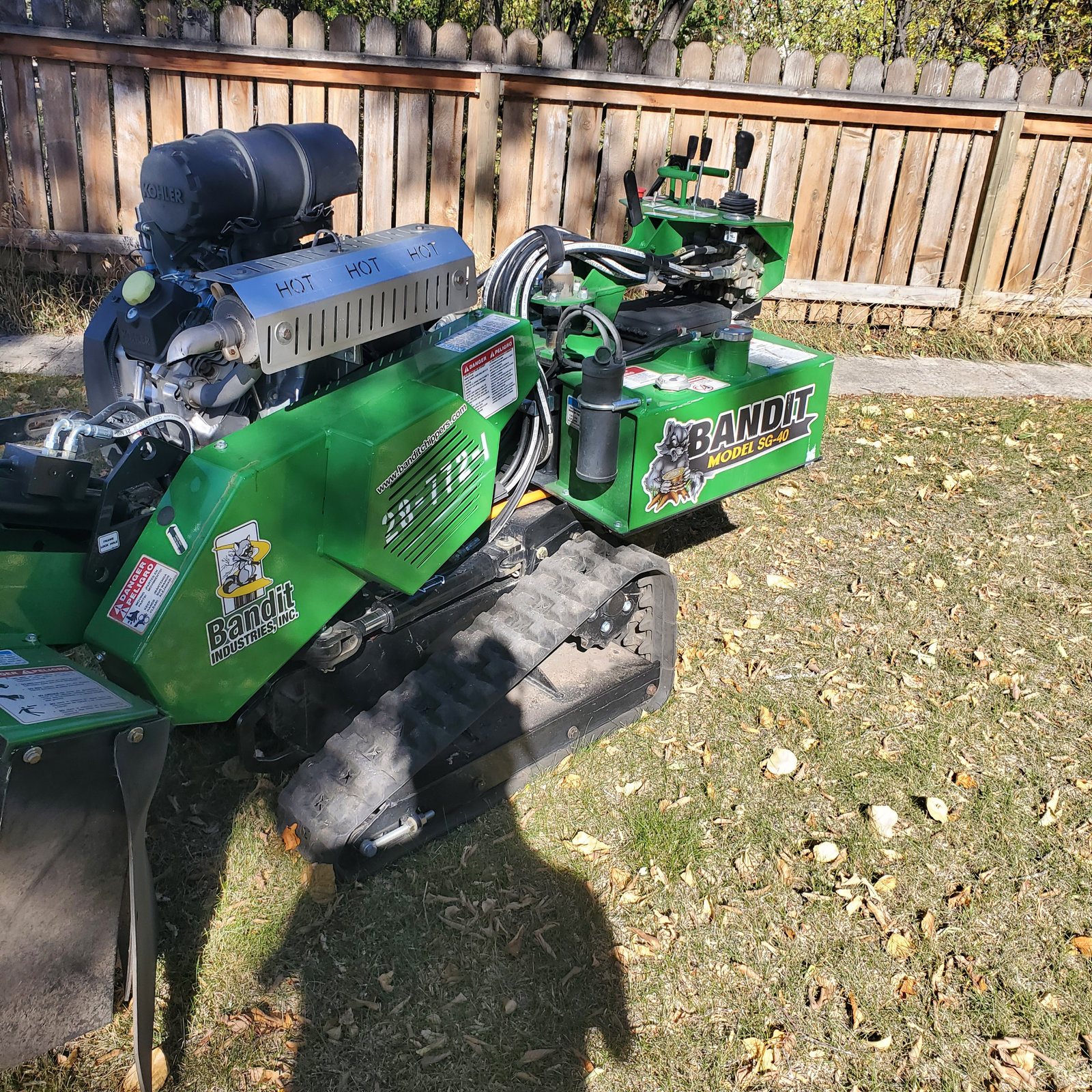 Stump grinder removing a tree stump below grade